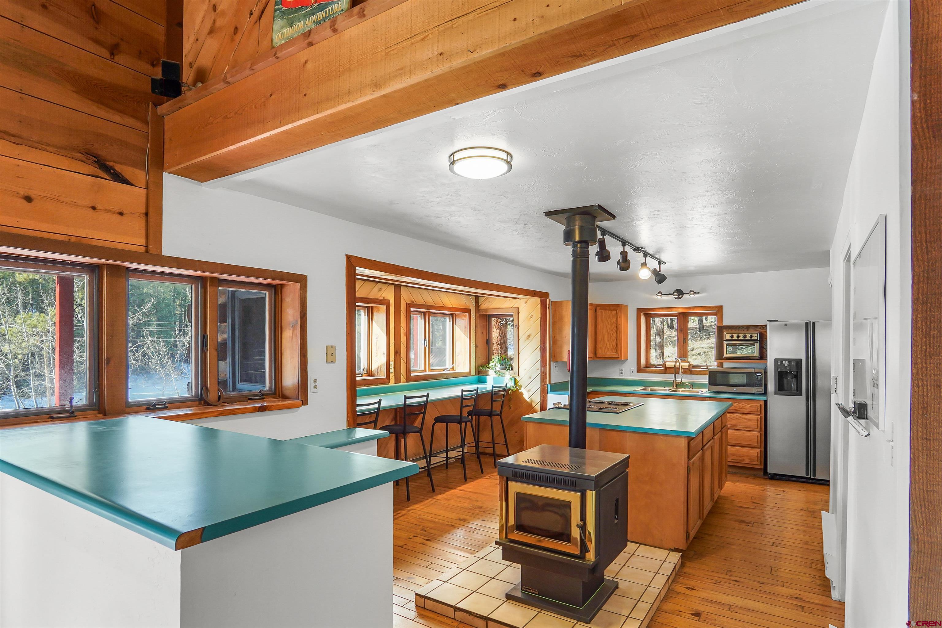 78 Groves Drive Durango, CO 81301 - Photo 8 of 35 a kitchen with stainless steel appliances granite countertop a sink a stove and a refrigerator