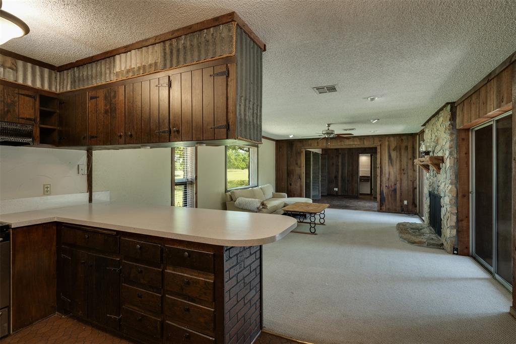 3377 Lodge Creek Road Henrietta, TX 76365 - Photo 11 of 40 a living room with a large window and furniture