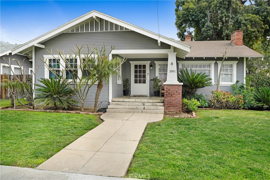 3592 Locust Street Riverside, CA 92501 - Photo 1 of 1 a front view of a house with garden