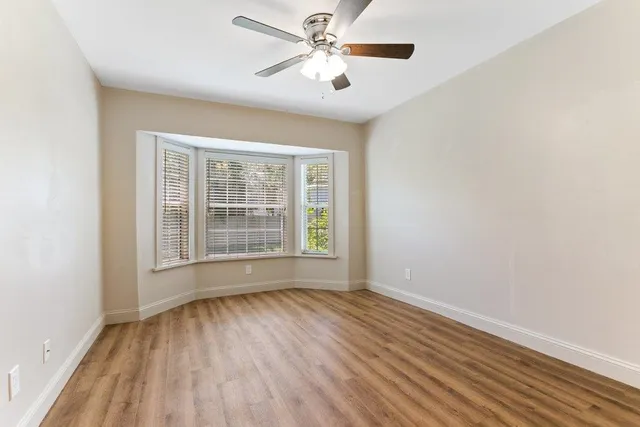 a view of a field with sitting area