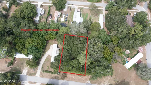 an aerial view of red and white house