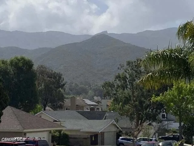a view of a town with mountains in the background