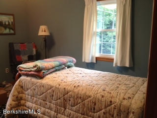 1071 Savoy Road Windsor, MA 01270 - Photo 14 of 23 a bedroom with a bed and a window