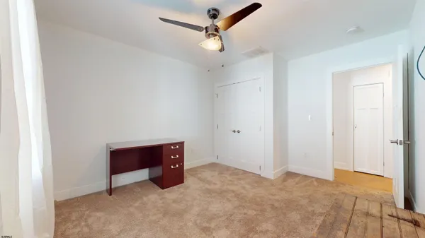 a kitchen with stainless steel appliances granite countertop a stove a sink and a chandelier