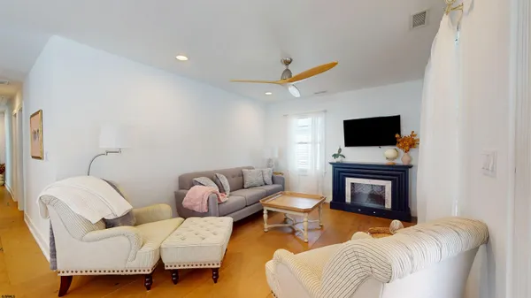 a en suite bathroom with a granite countertop sink and a mirror