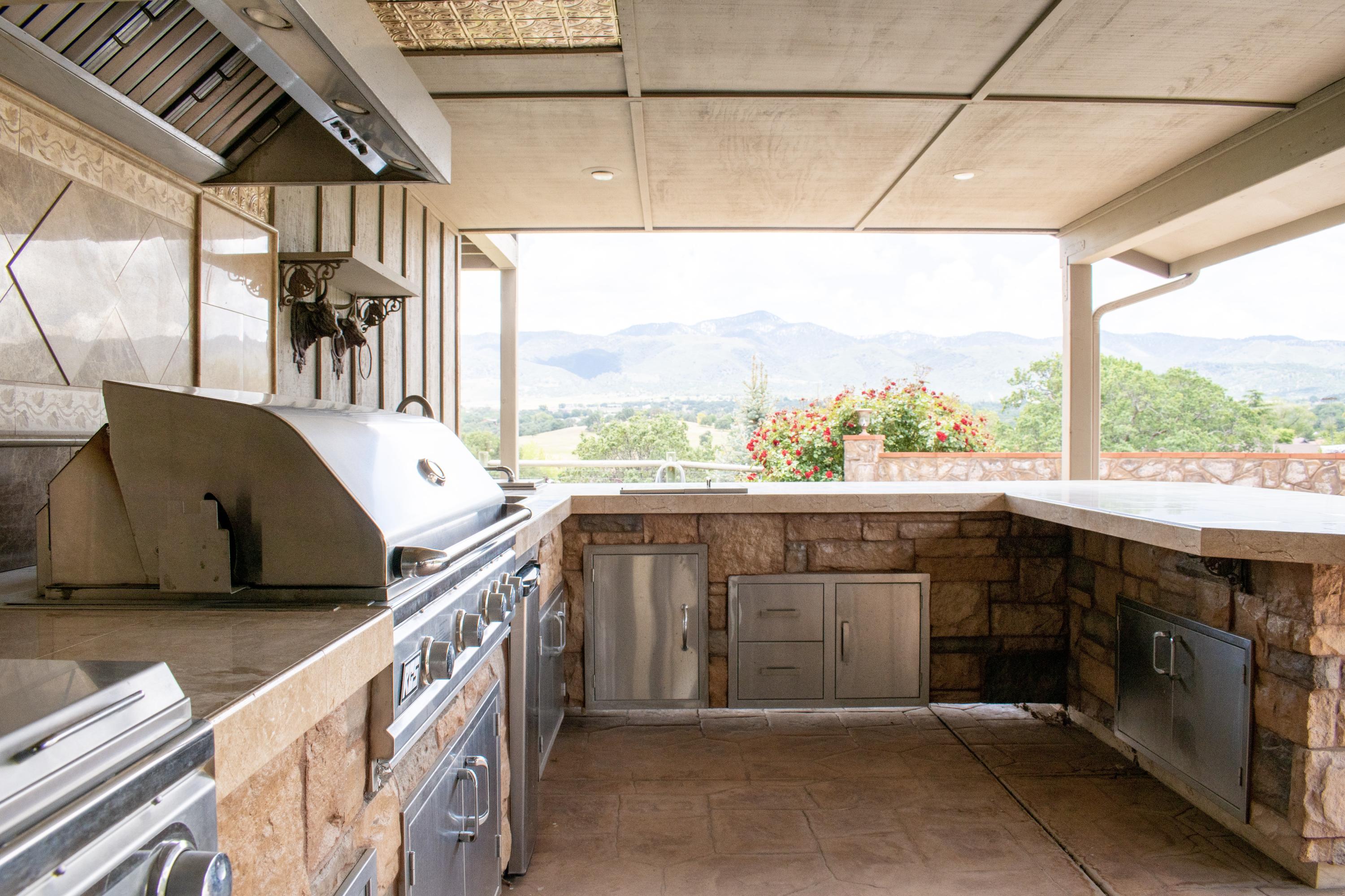 21175 Ridgeway Drive Tehachapi, CA 93561 - Photo 11 of 45 a open kitchen view with a sink and dishwasher next to a window