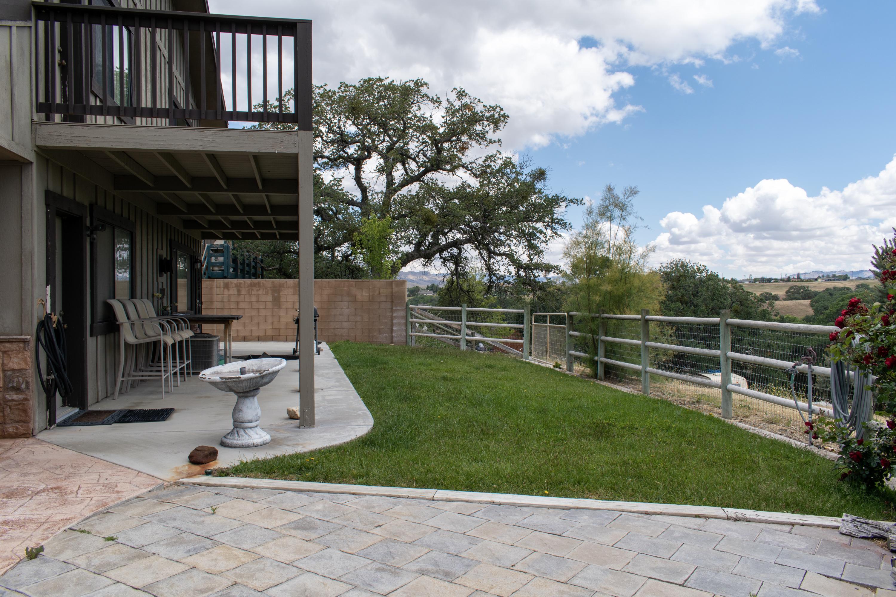 21175 Ridgeway Drive Tehachapi, CA 93561 - Photo 15 of 45 a front view of a house with garden