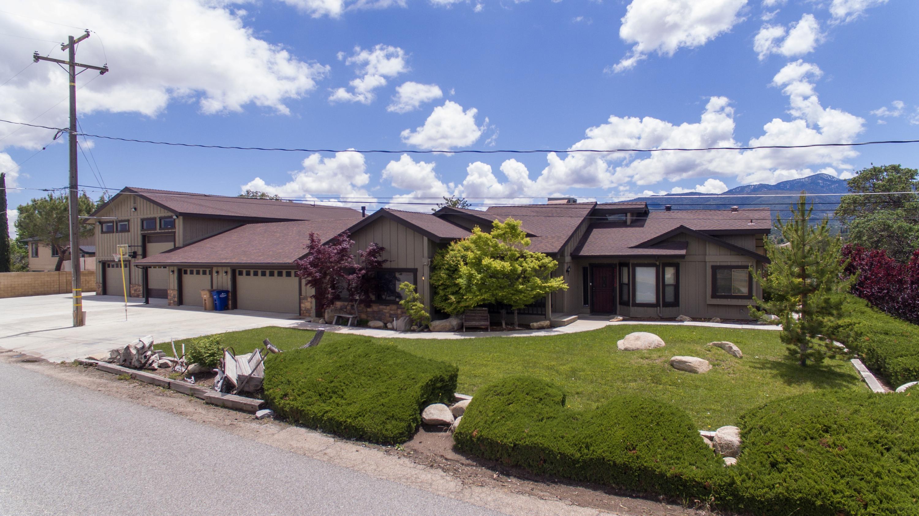 21175 Ridgeway Drive Tehachapi, CA 93561 - Photo 3 of 45 a front view of a house with garden