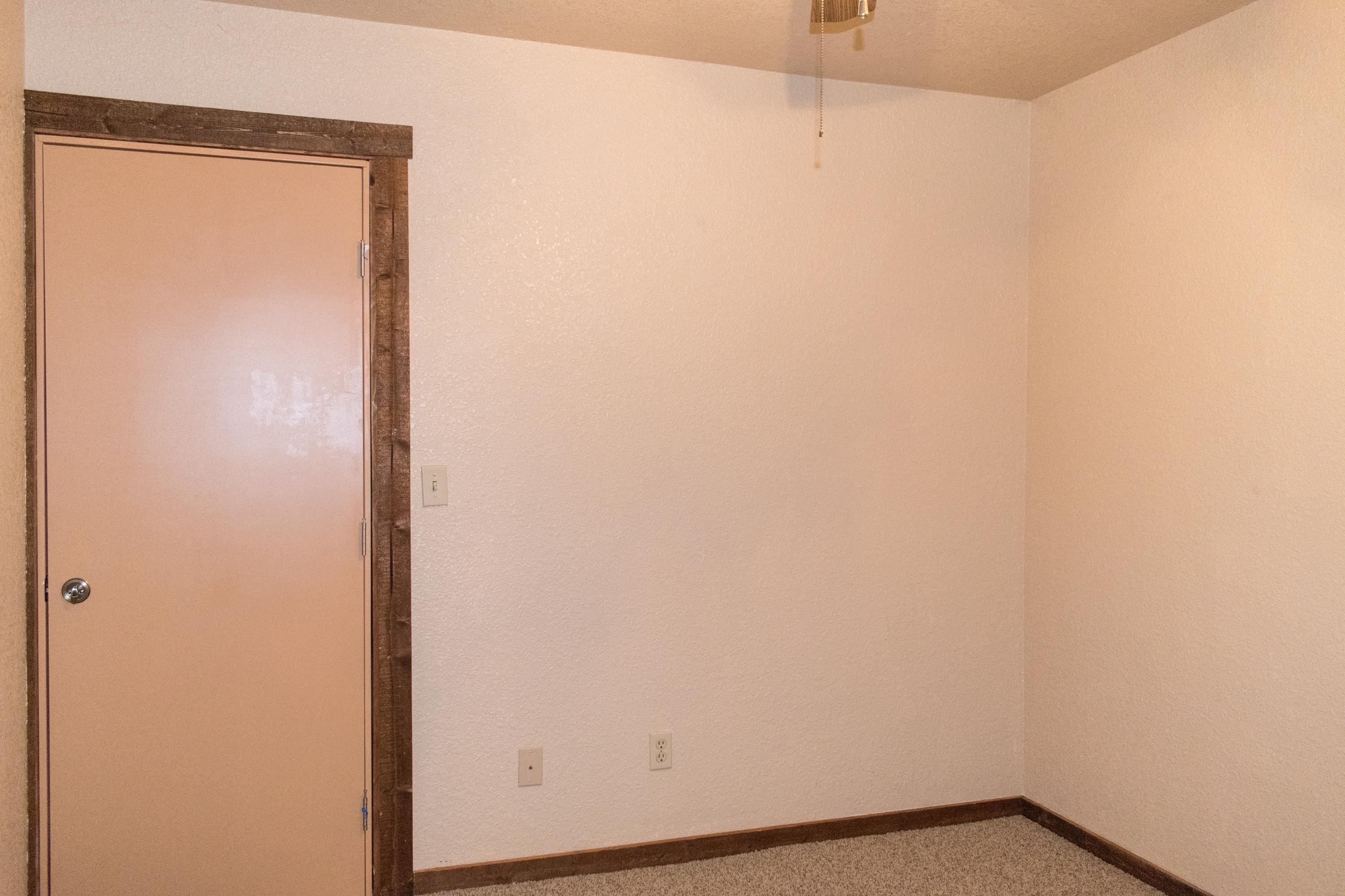 21175 Ridgeway Drive Tehachapi, CA 93561 - Photo 36 of 45 a view of a small space with wooden floor and a window
