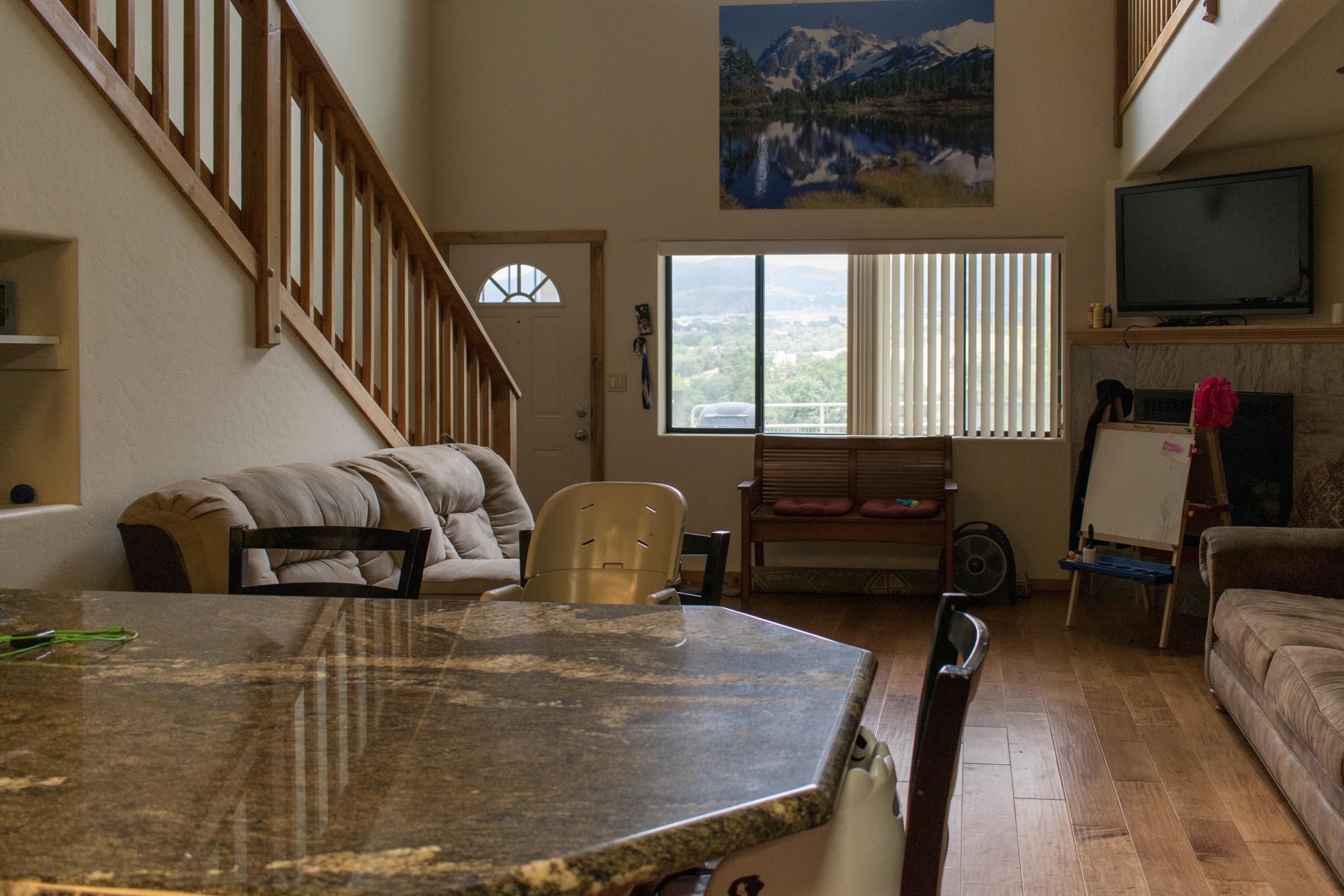 21175 Ridgeway Drive Tehachapi, CA 93561 - Photo 38 of 45 a living room with furniture and a flat screen tv