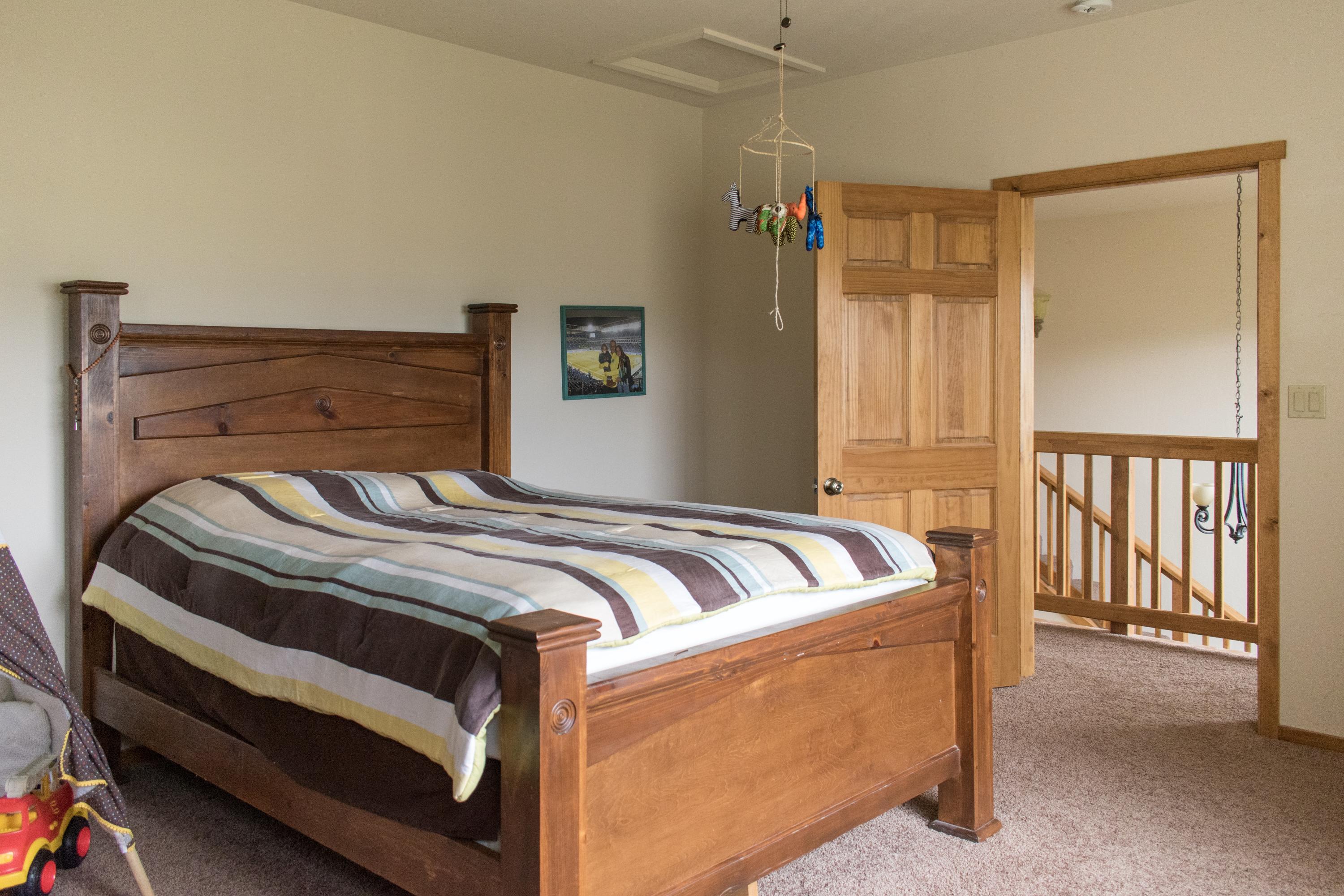 21175 Ridgeway Drive Tehachapi, CA 93561 - Photo 44 of 45 a bedroom with bed and balcony