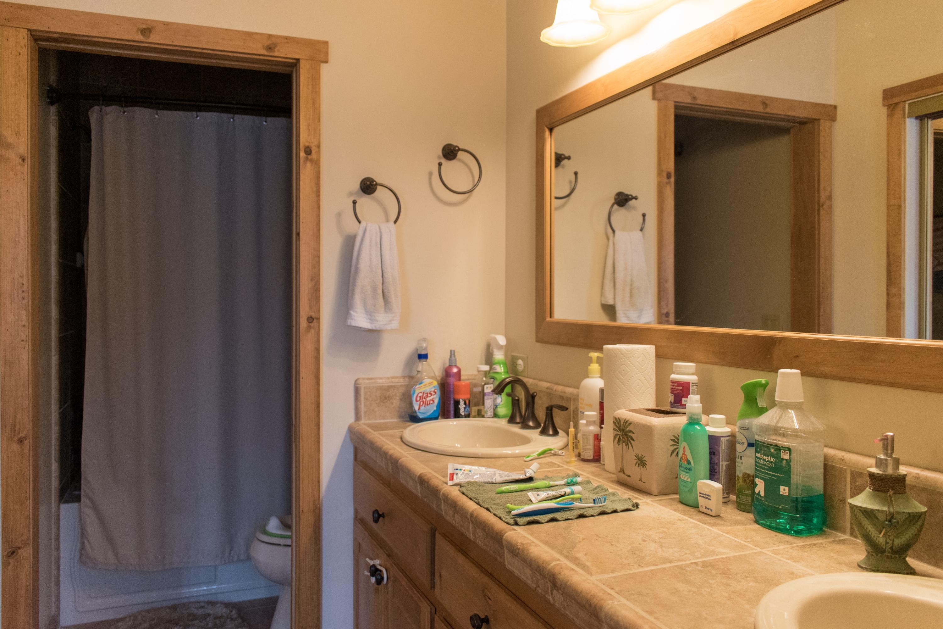 21175 Ridgeway Drive Tehachapi, CA 93561 - Photo 45 of 45 a bathroom with a sink and a mirror