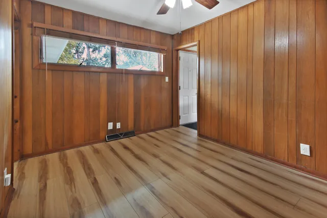 a view of a room with wooden walls