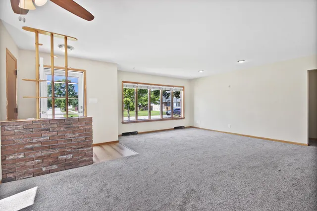 a kitchen with stainless steel appliances a stove microwave and cabinets