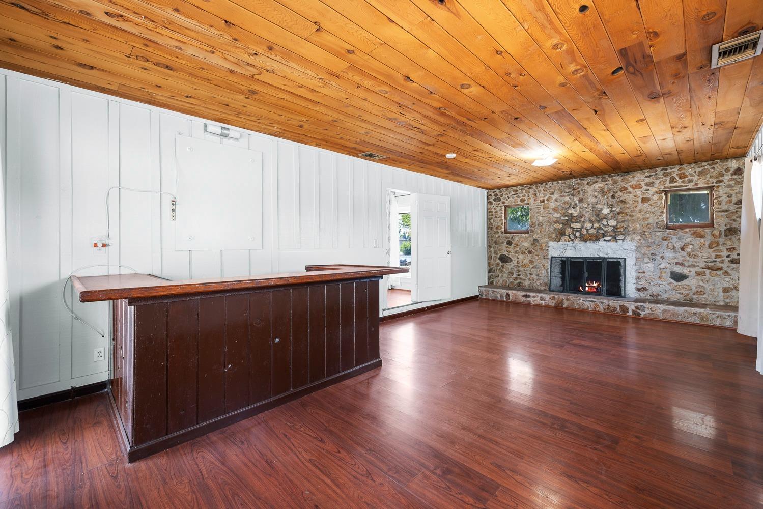 3009 Fowler Avenue Clovis, CA 93611 - Photo 13 of 34 a kitchen with wooden floors and fireplace