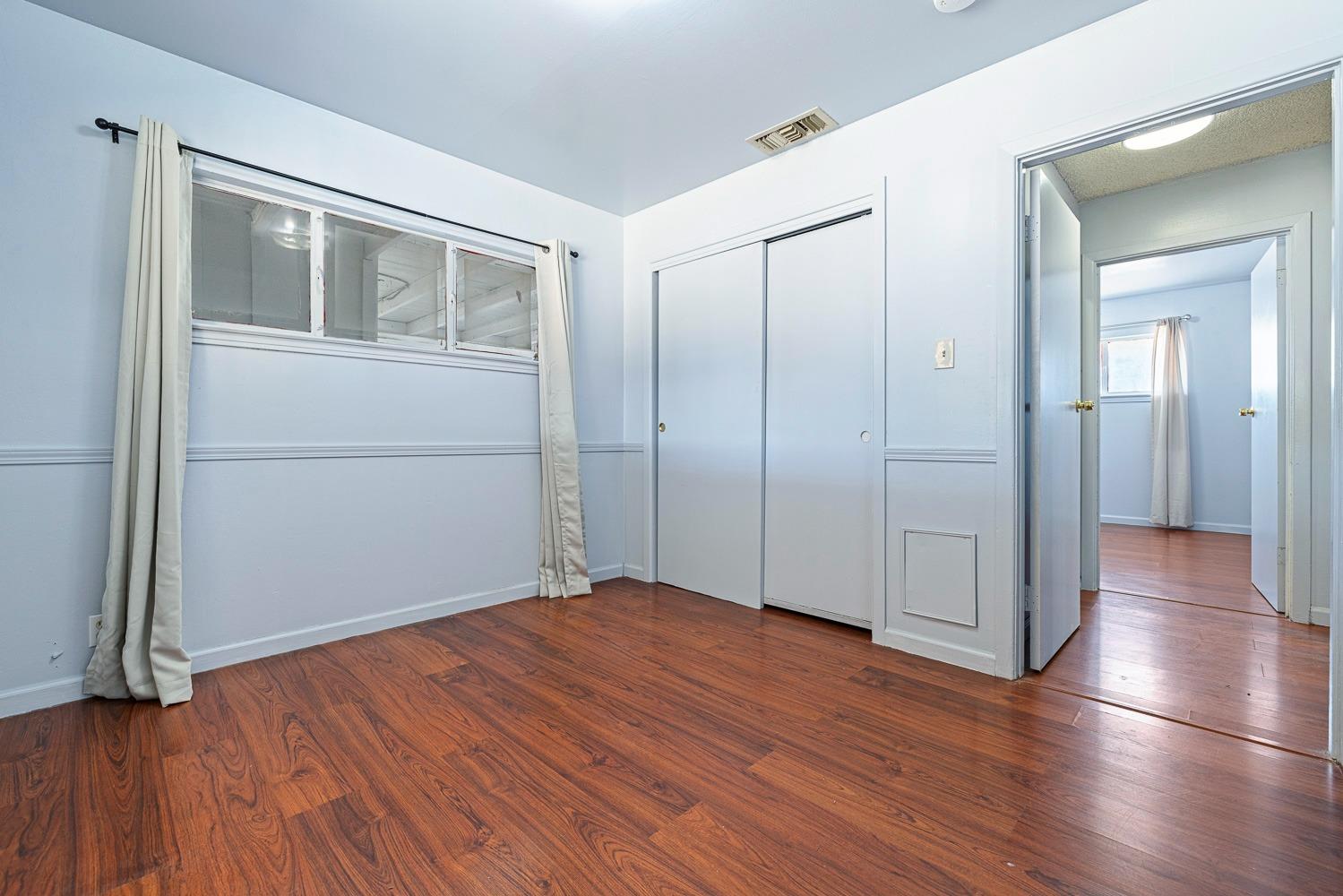 3009 Fowler Avenue Clovis, CA 93611 - Photo 20 of 34 wooden floor in an empty room with a window