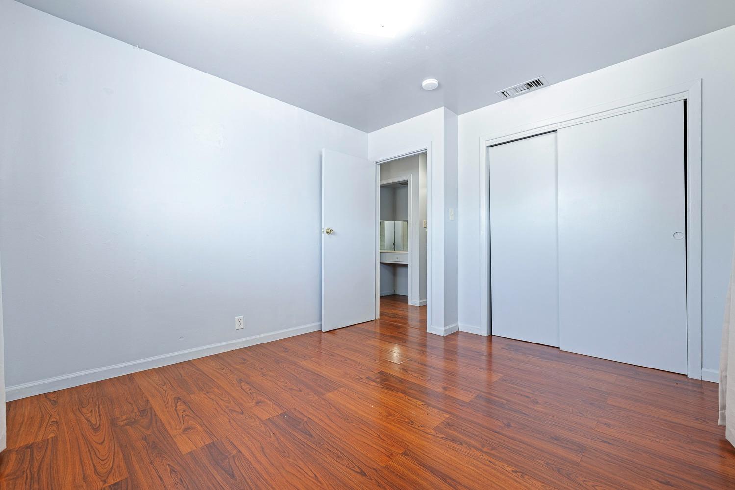 3009 Fowler Avenue Clovis, CA 93611 - Photo 26 of 34 a view of an empty room with wooden floor