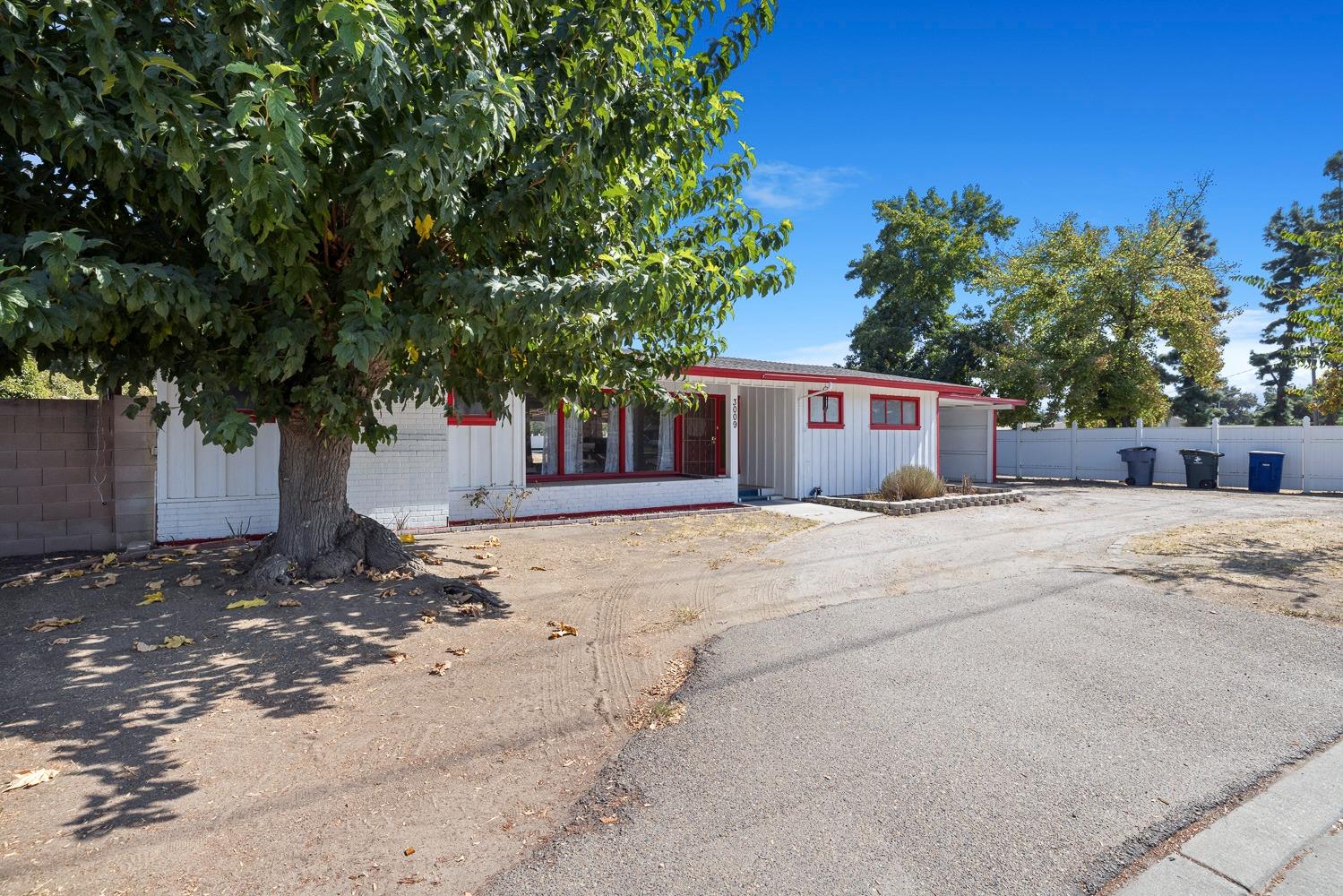 3009 Fowler Avenue Clovis, CA 93611 - Photo 3 of 34 a front view of a house with a tree