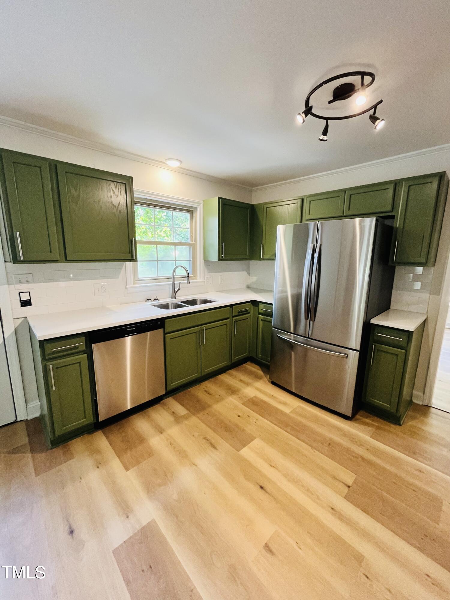 120 Dundee Road Fayetteville, NC 28303 - Photo 25 of 32 a kitchen with stainless steel appliances granite countertop a tiny refrigerator and a sink
