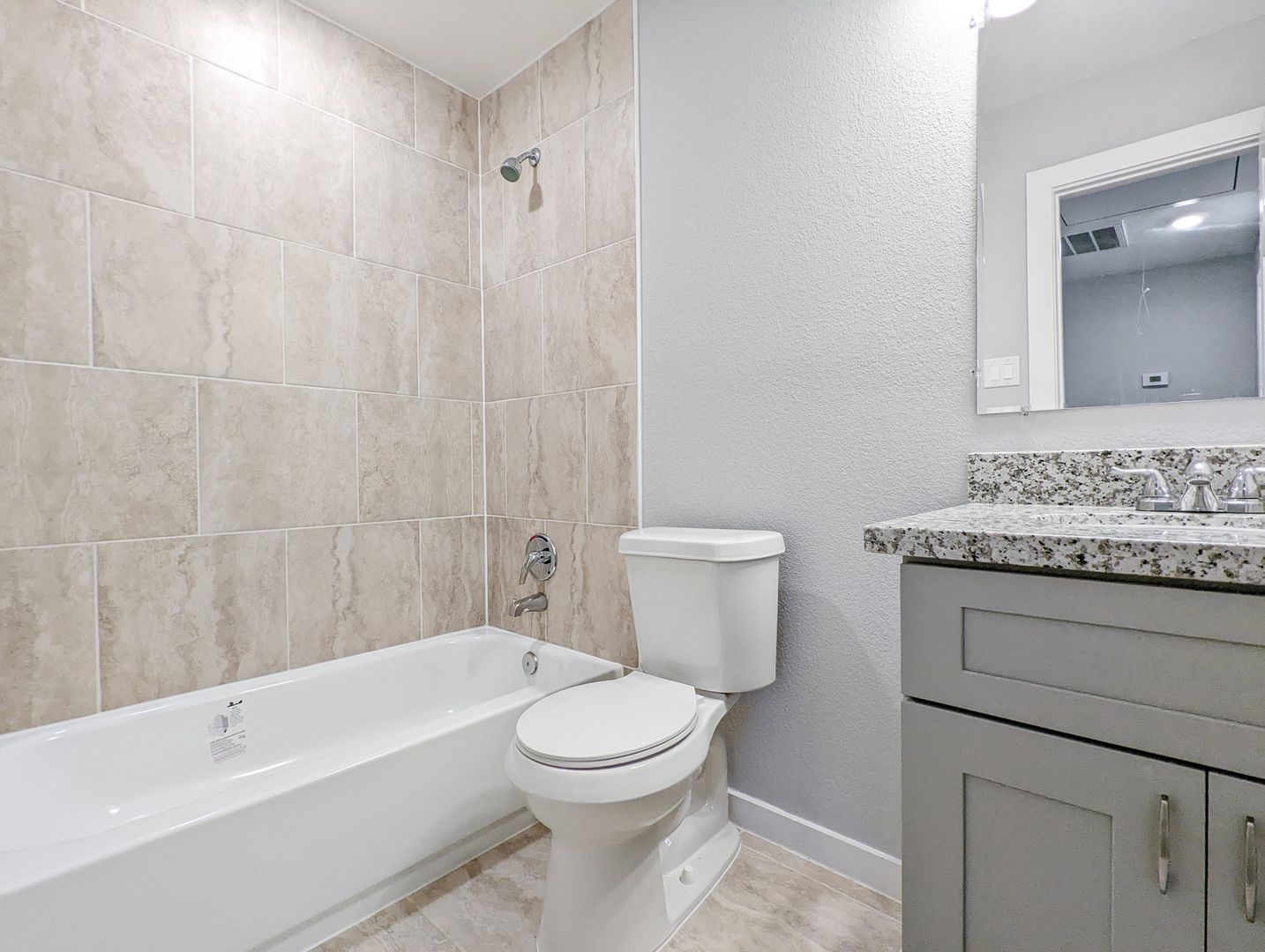 6811 Glass Street, Unit B Houston, TX 77016 - Photo 15 of 17 a bathroom with a toilet a sink and bathtub