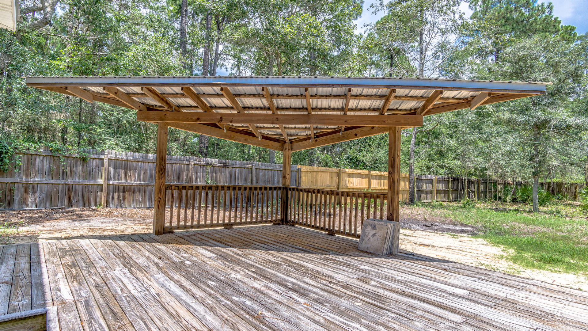 691 Mallet Bayou Road Freeport, FL 32439 - Photo 42 of 49 a view of a backyard with a small deck and a garden