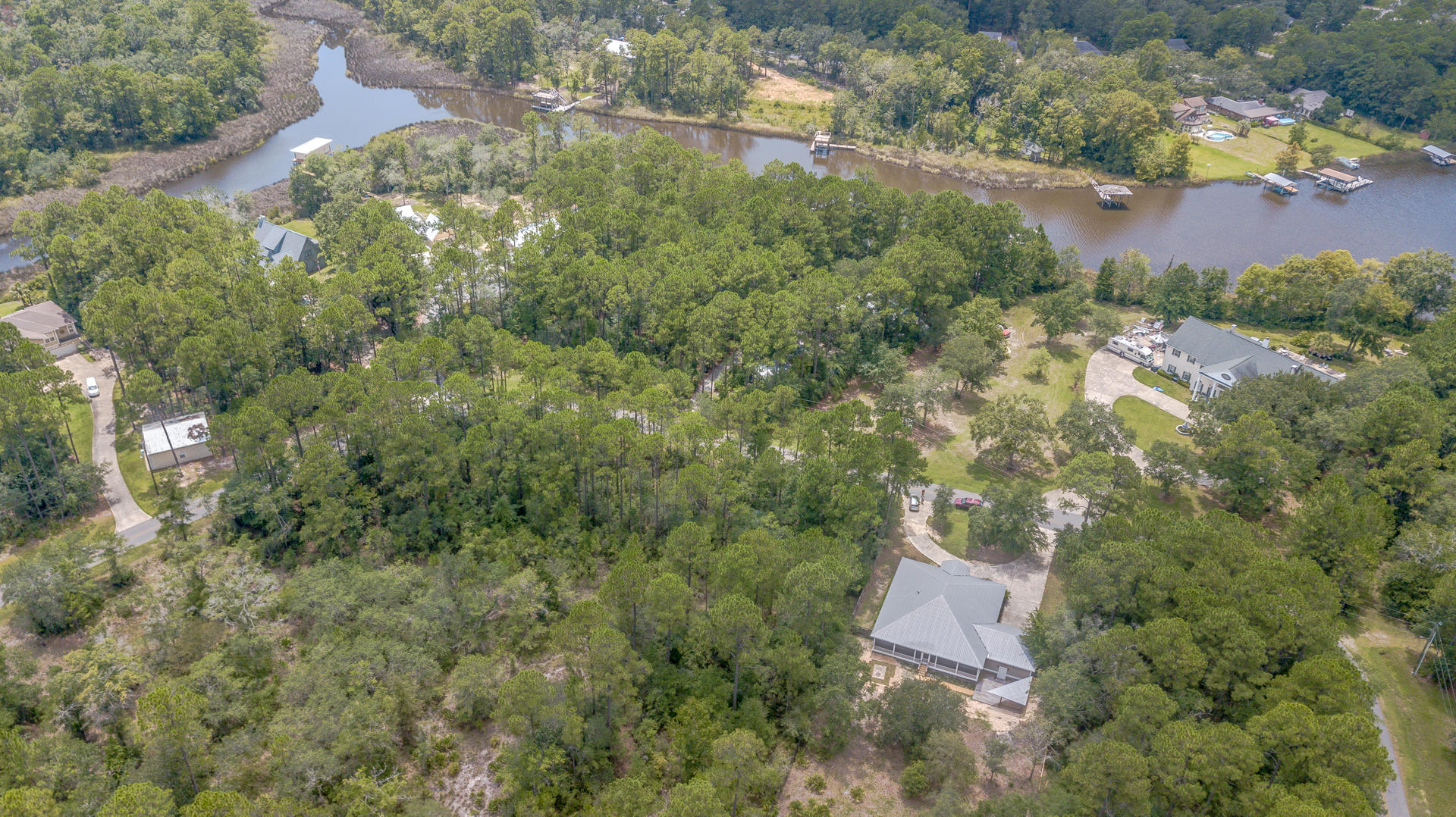 691 Mallet Bayou Road Freeport, FL 32439 - Photo 45 of 49 an aerial view of residential house with outdoor space and trees all around