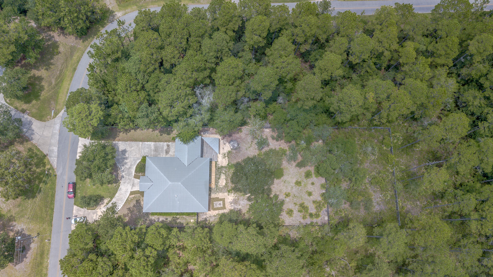 691 Mallet Bayou Road Freeport, FL 32439 - Photo 46 of 49 an aerial view of a house with a yard and large trees