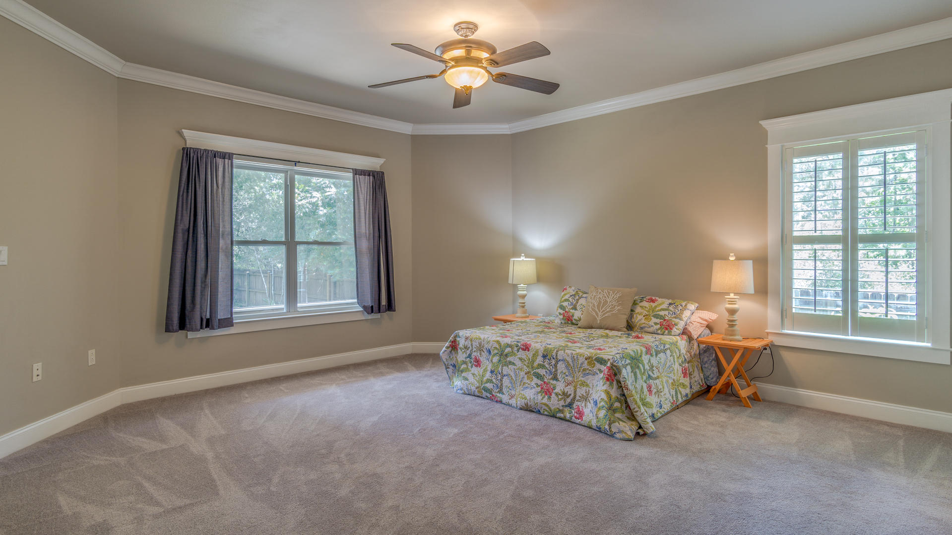 691 Mallet Bayou Road Freeport, FL 32439 - Photo 6 of 49 a bedroom with a bed and a chandelier fan