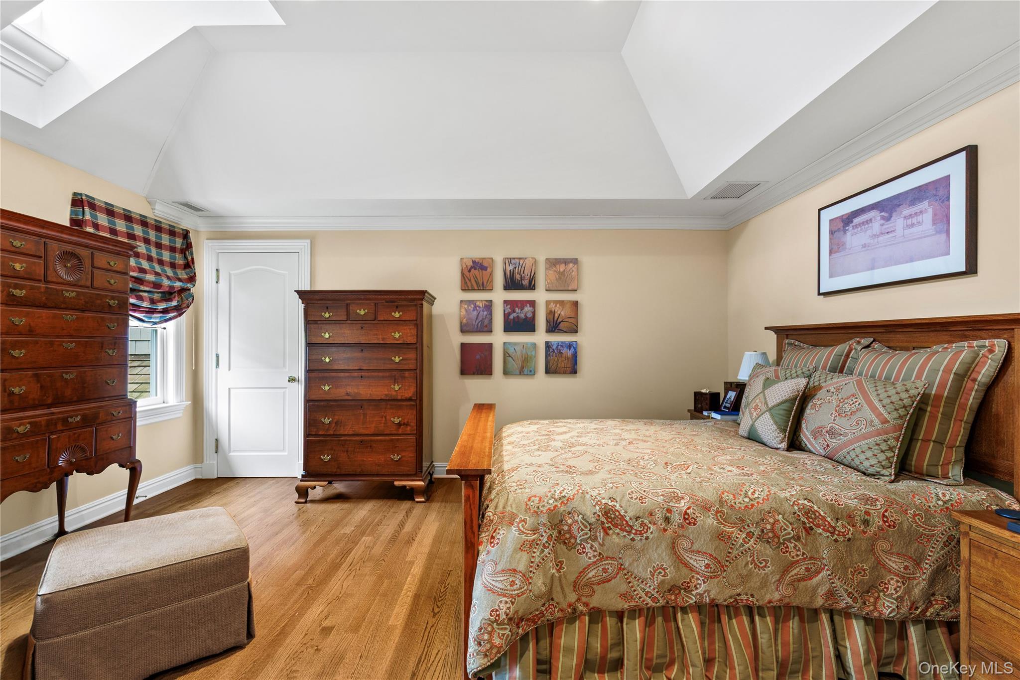 63 Old Mill River Road Pound Ridge, NY 10576 - Photo 21 of 47 a bedroom with a bed and wooden floor