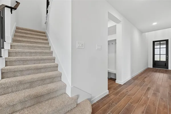 a view of entryway with wooden floor