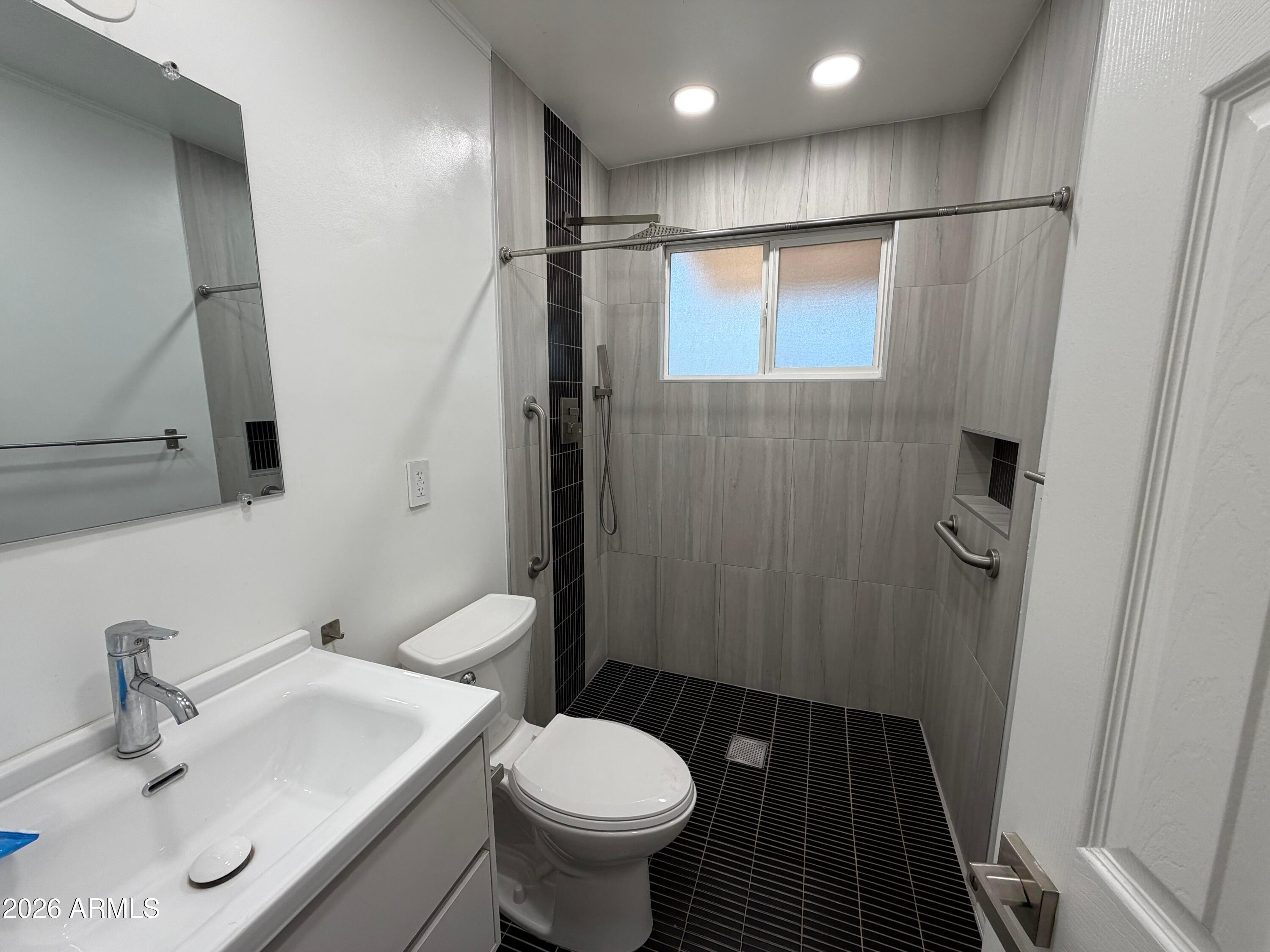 2 East Piedmont Road Phoenix, AZ 85042 - Photo 6 of 13 a bathroom with a sink toilet and shower