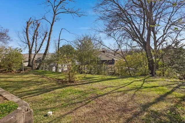a view of a playground with basketball court