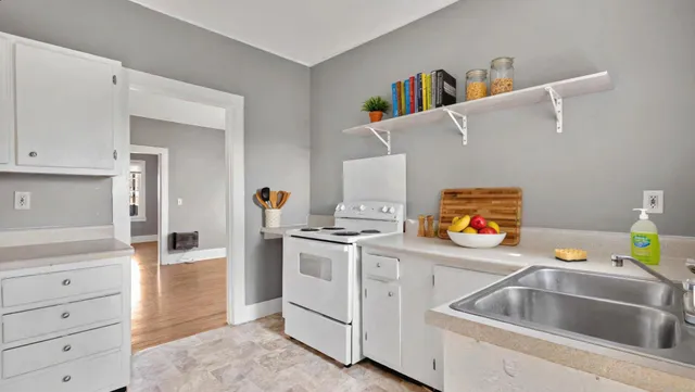 a kitchen with a stove and a sink