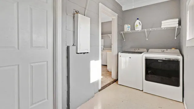 a utility room with dryer and washer
