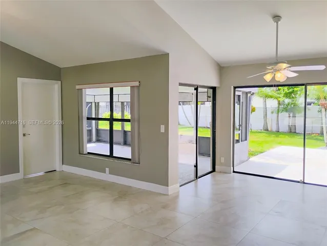 a garden with trees in front of it