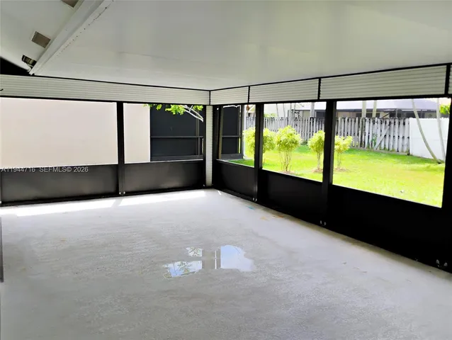 a view of an empty room with a large window