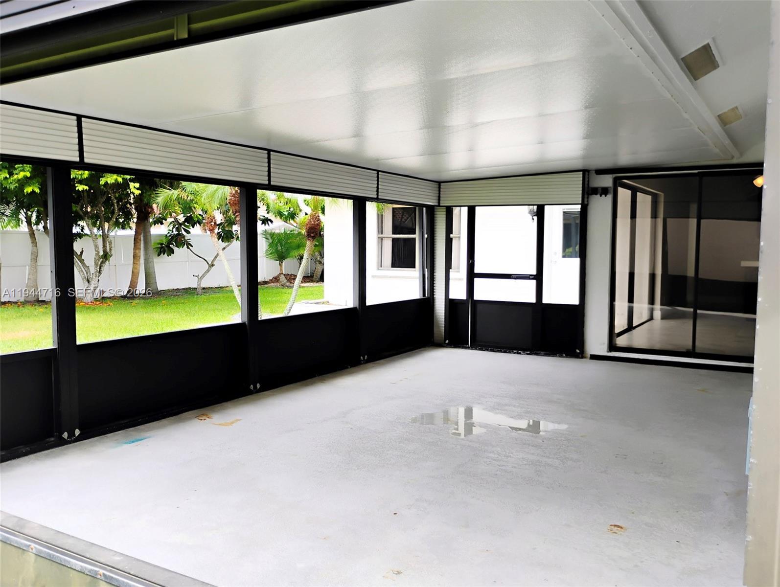 9654 Sun Pointe Drive Boynton Beach, FL 33437 - Photo 22 of 52 a view of an empty room with a large window