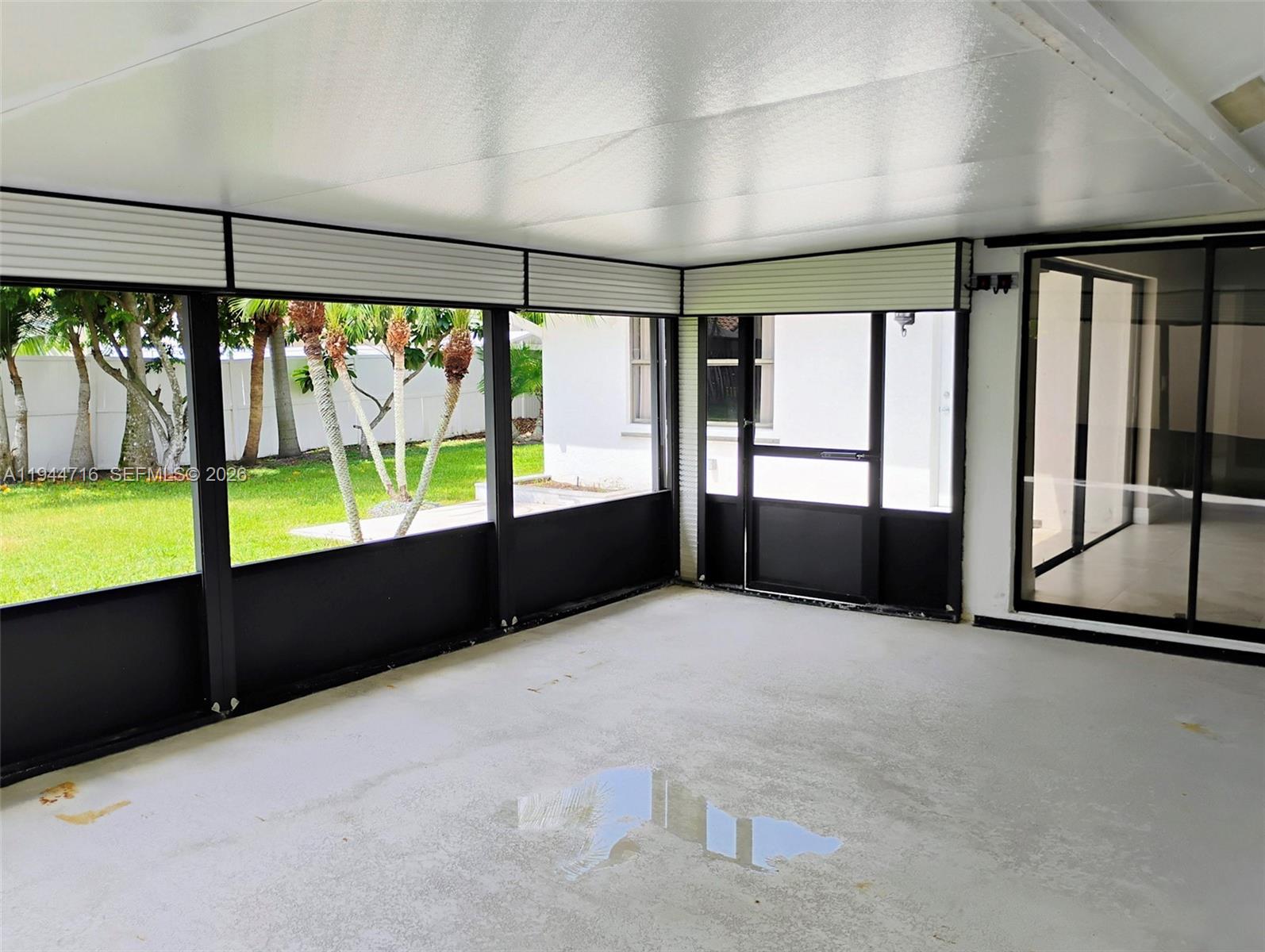 9654 Sun Pointe Drive Boynton Beach, FL 33437 - Photo 25 of 52 wooden floor in an empty room with a window