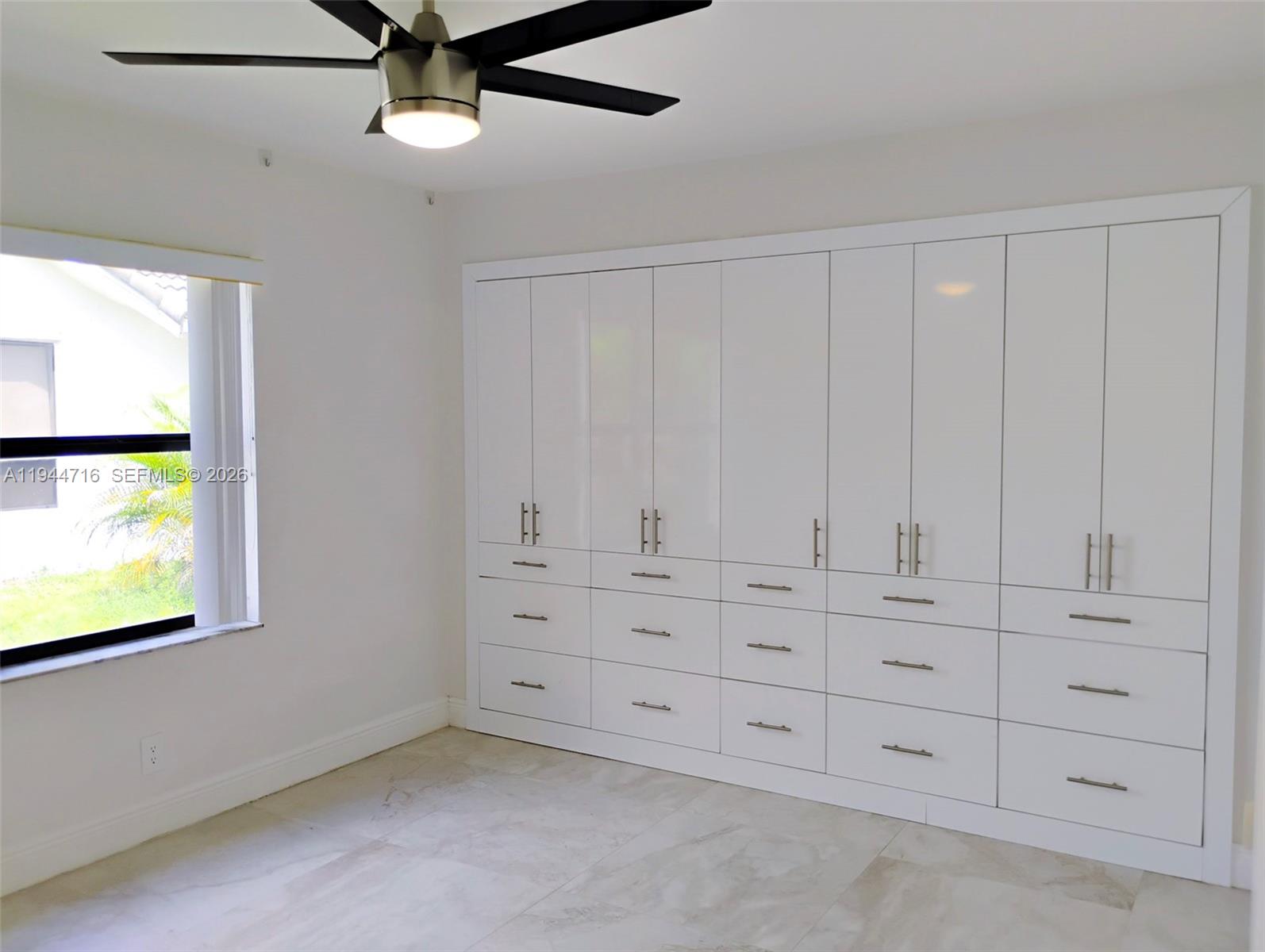 9654 Sun Pointe Drive Boynton Beach, FL 33437 - Photo 34 of 52 a view of an empty room with a window