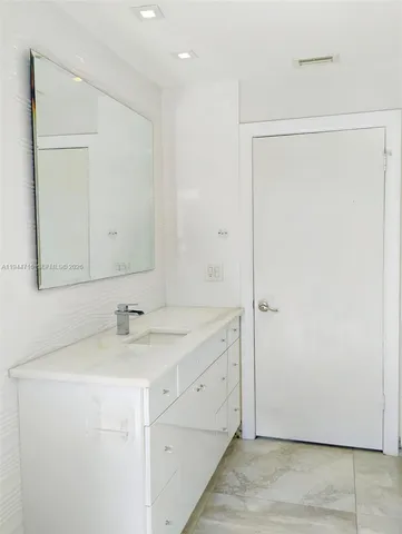 an empty room with a fan