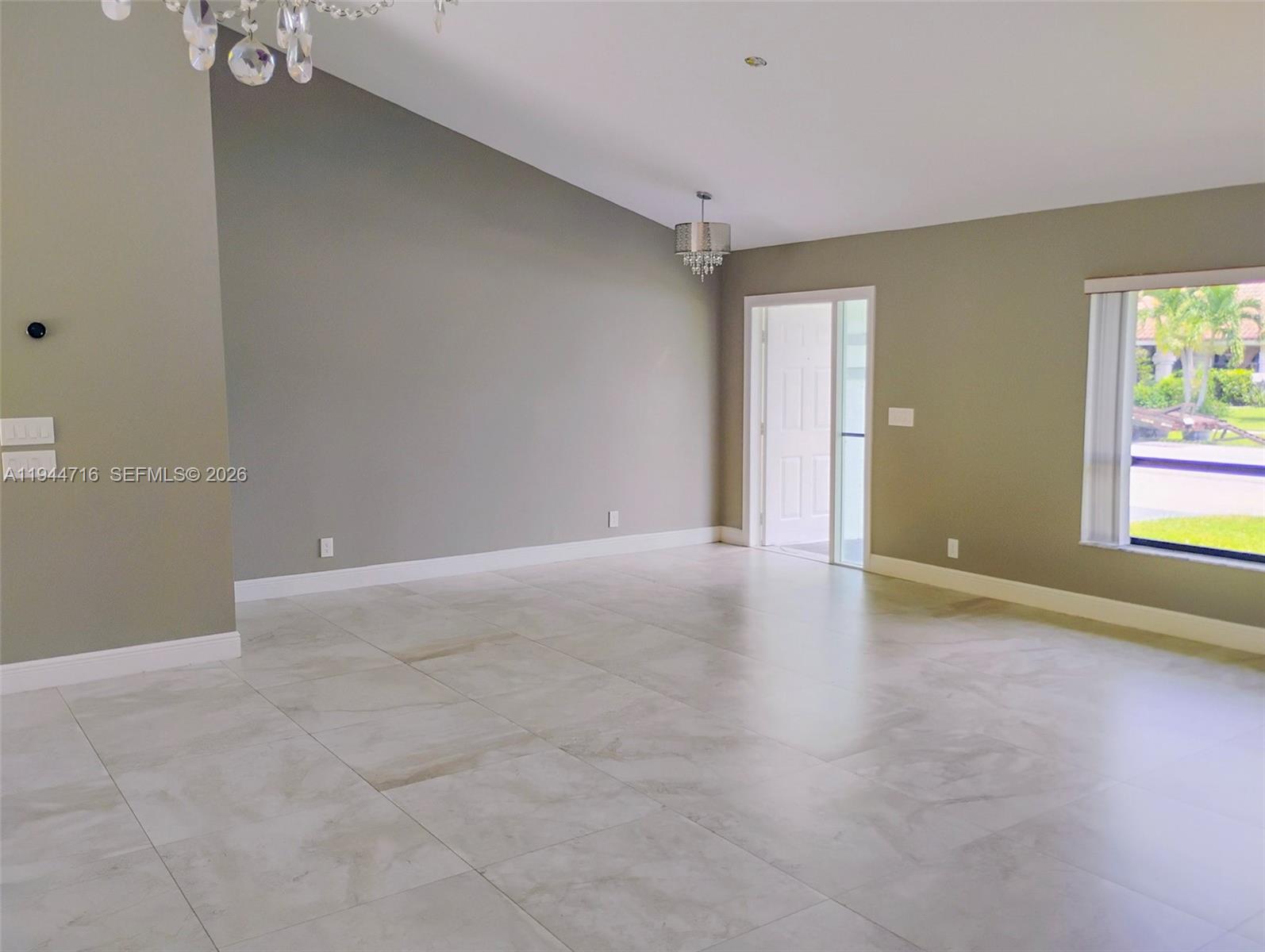 9654 Sun Pointe Drive Boynton Beach, FL 33437 - Photo 4 of 52 an empty room with windows