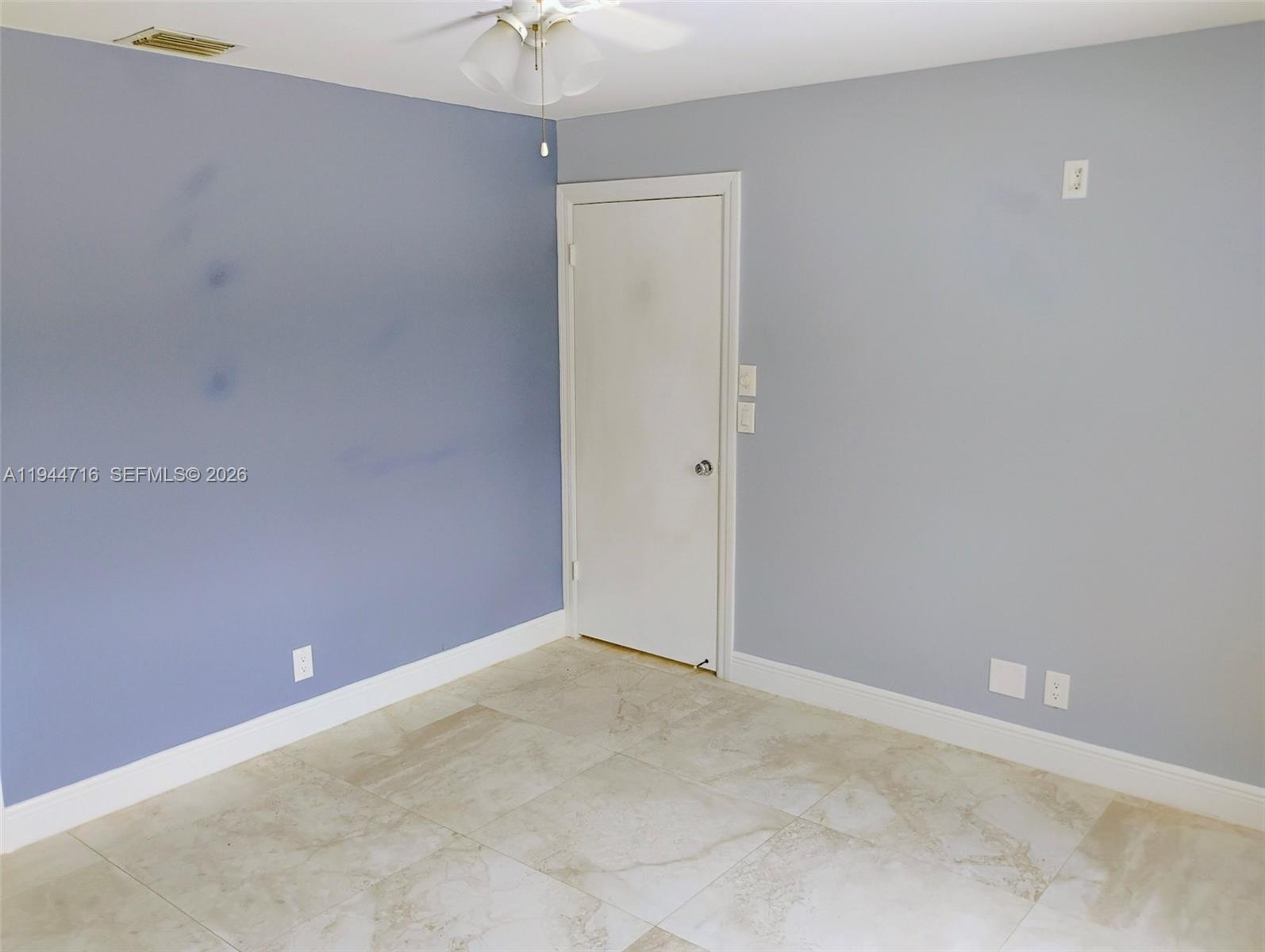 9654 Sun Pointe Drive Boynton Beach, FL 33437 - Photo 41 of 52 an empty room with a fan