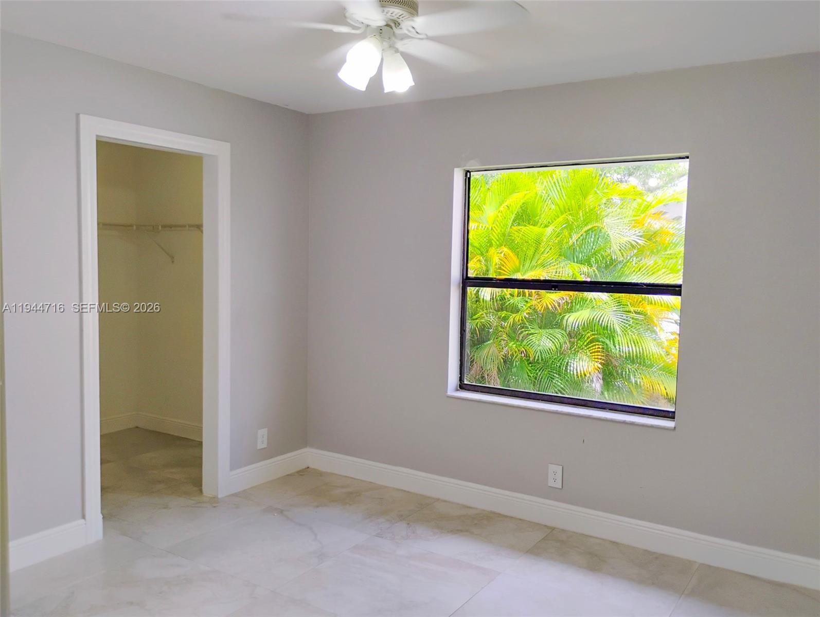 9654 Sun Pointe Drive Boynton Beach, FL 33437 - Photo 43 of 52 an empty room with a window