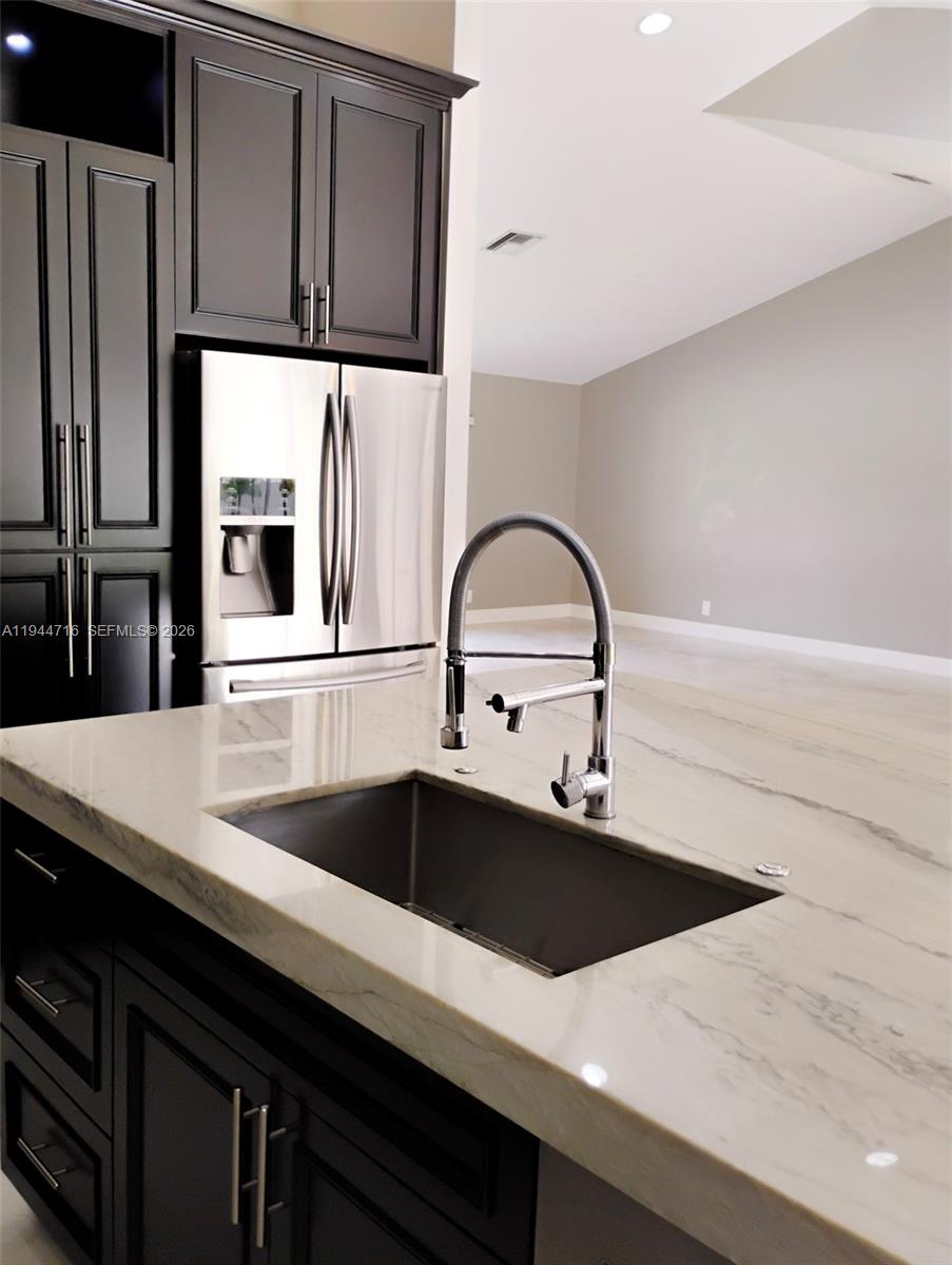 9654 Sun Pointe Drive Boynton Beach, FL 33437 - Photo 10 of 52 a close view of sink and tap