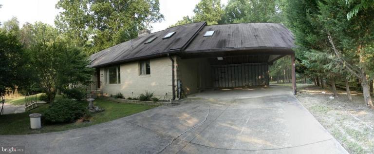 a backyard of house with seating space