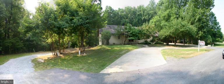 1400 Woodwell Road Silver Spring, MD 20906 - Photo 19 of 20 a swimming pool with trees in the background