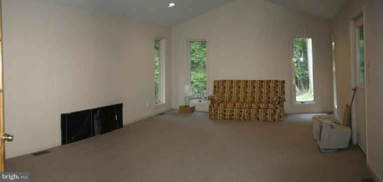 1400 Woodwell Road Silver Spring, MD 20906 - Photo 6 of 20 an empty room with windows and cabinet