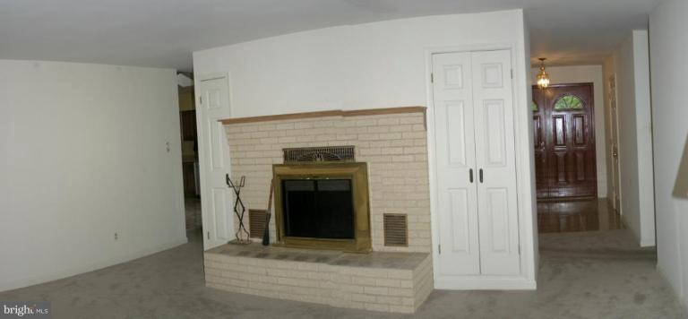 1400 Woodwell Road Silver Spring, MD 20906 - Photo 8 of 20 a view of an empty room with a fireplace