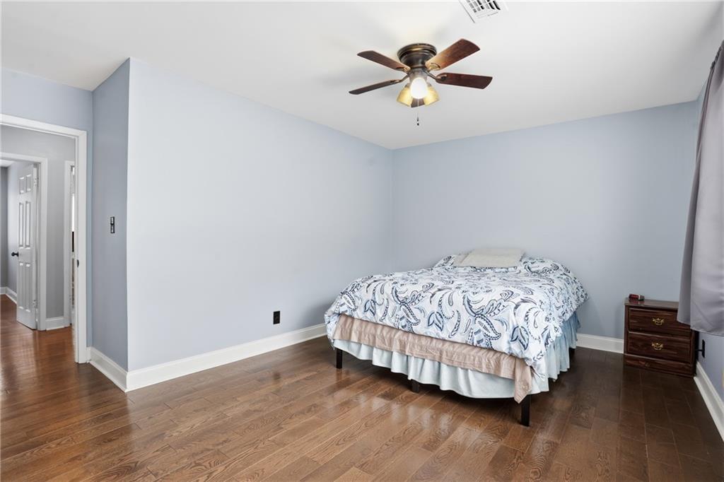 3320 Northcrest Road, Unit C Atlanta, GA 30340 - Photo 17 of 34 a bedroom with a bed and a chandelier