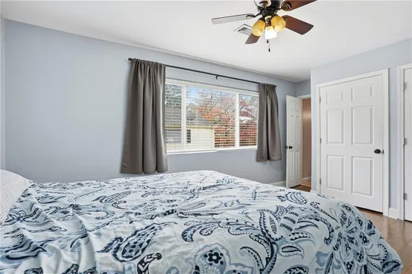 a bedroom with a bed and a window